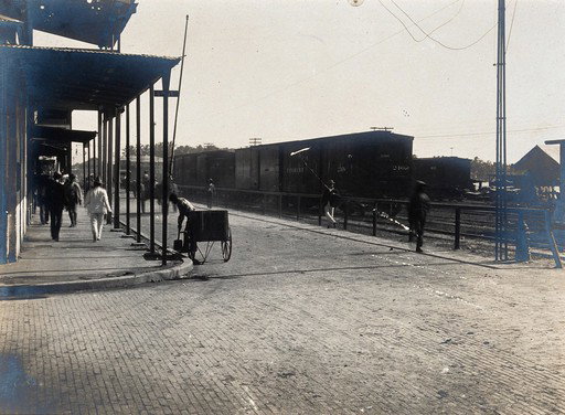 EU: Colón, Panama: newly paved street junction with pedestrians, carriages and train carriages. Photograph, (1906), Colón, Panama, 1906