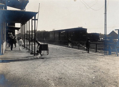 EU: Colón, Panama: newly paved street junction with pedestrians, carriages and train carriages. Photograph, (1906), Colón, 1906