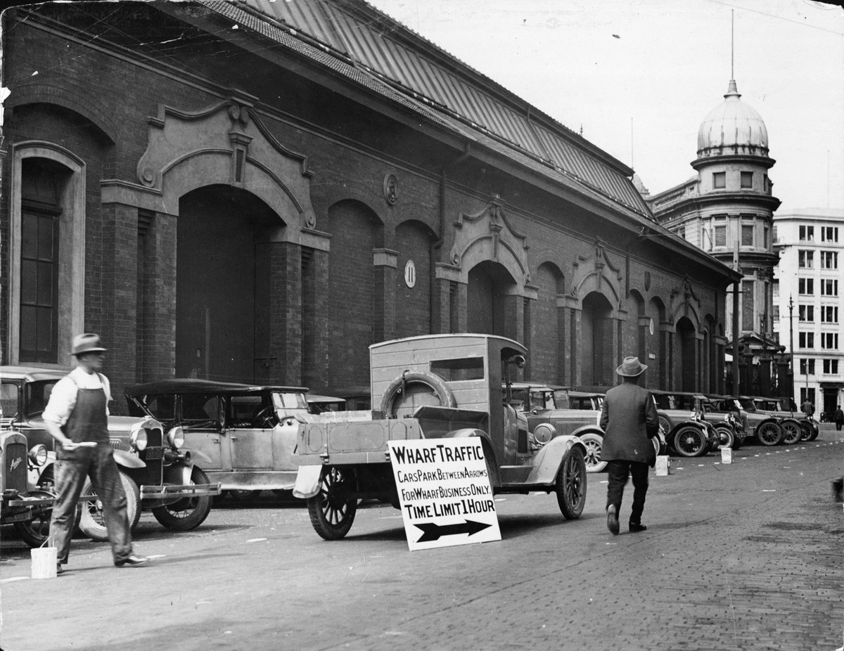Cars parked outside the Harbour Board's shed 11, Jervois Quay, Wellington, 3 March, Wellington, New Zealand, 1932