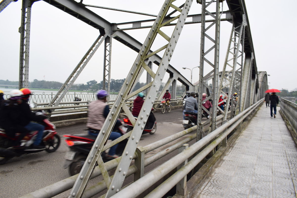 Motos wizzing over Truong Tien Bridge, Hue, Vietnam, 2018