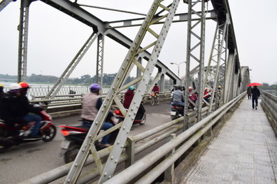 Motos wizzing over Truong Tien Bridge, Hue, 2018