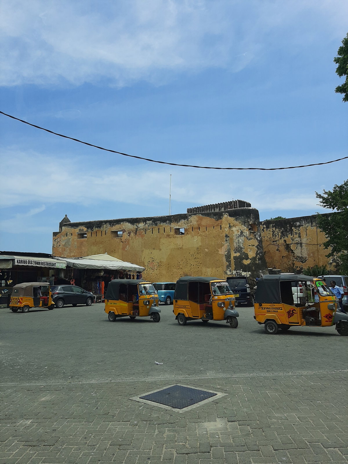 Tuk Tuk taxis by Fort Jesus in Mombasa, Mombasa, Kenya, 2020