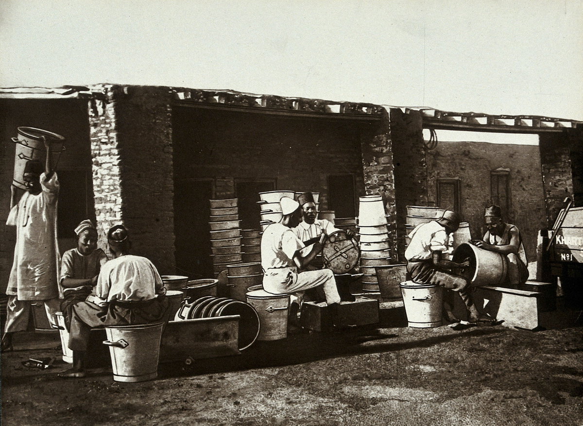 EU: The Khartoum Sanitary Service: Sudanese men repairing buckets, Khartoum, Sudan. Photograph, ca. (1911), Khartoum, Sudan, 1911