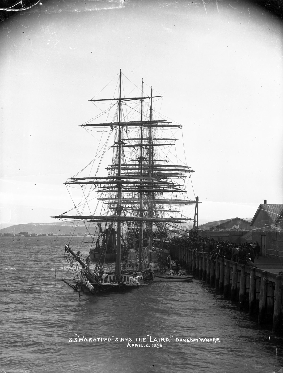 The S.S. Wakatipu sinks the Laira at Dunedin wharf, 2 April, Dunedin, New Zealand, 1898