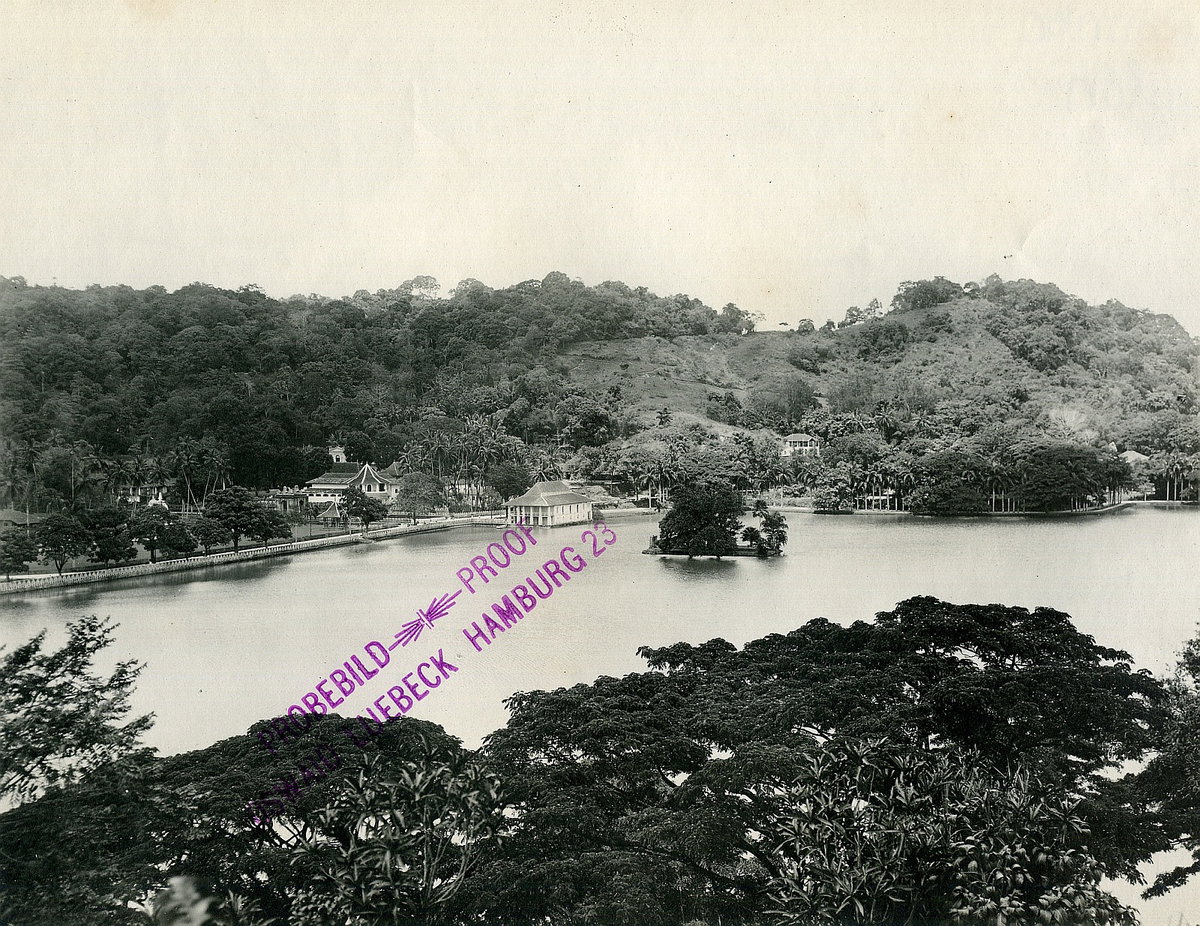 EU: Colombo, Sri Lanka. View over a sea park landscape with lush vegetation and bay with probably artificially designed islets against populated riverside zone (1913), Colombo, Sri Lanka, 1913