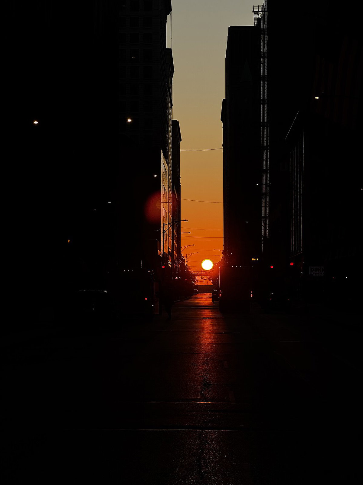 near-equinoctial sunrise in Chicago, Illinois viewed along Jackson Boulevard, Chicago, United States, 2024