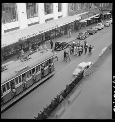 ANZAC Day - celebration drinks, marching down Pitt Street, April 1950, from Series 02- Sydney people and streets, 1948-1950, photographed by Brian Bird, Sydney, 1950