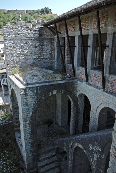 Gjirokastra - Kadare-Haus - View from bedroom at staircase, minaret and castle, Gjirokastër, 2013