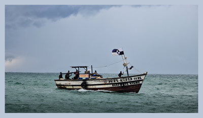 A fishing boat comes home, Axim — photos through time