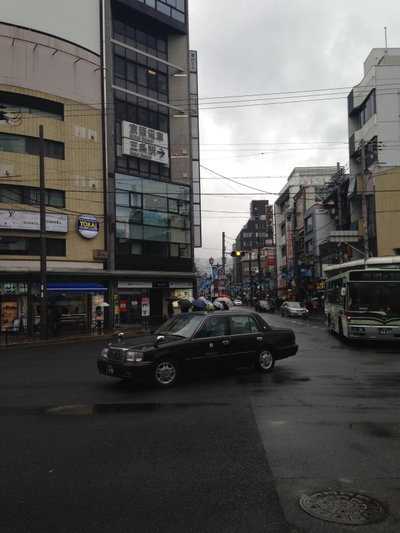 Crossroads of Kawaramachi-Sanjo in a rainy day, Kyoto — photos through time