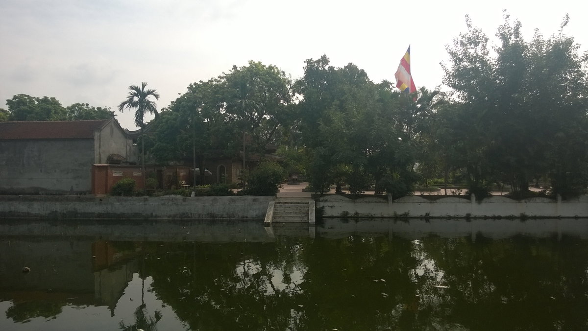 View of the Kim Lien Pagoda from across a pond, Hanoi, Vietnam, 2014