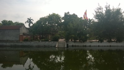 View of the Kim Lien Pagoda from across a pond, Hanoi, 2014