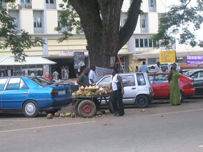 Selling coco nuts , Adum - Kumasi, Kumasi — photos through time