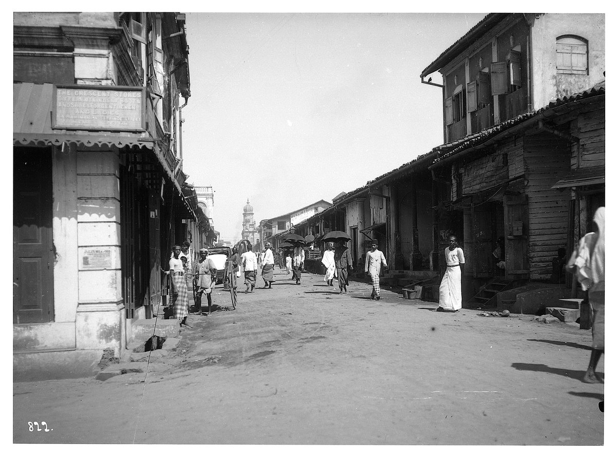 EU: Colombo (Sri Lanka). Shop street with rickshaw driver and pedestrians (1913), Colombo, Sri Lanka, 1913