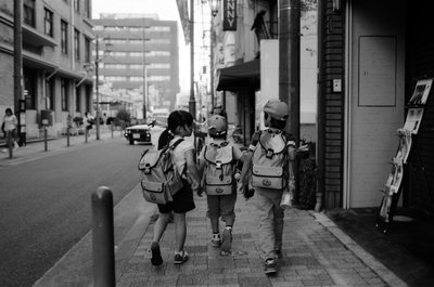 Elementary schoolkids in Kyoto, Japan; October, Kyoto — photos through time