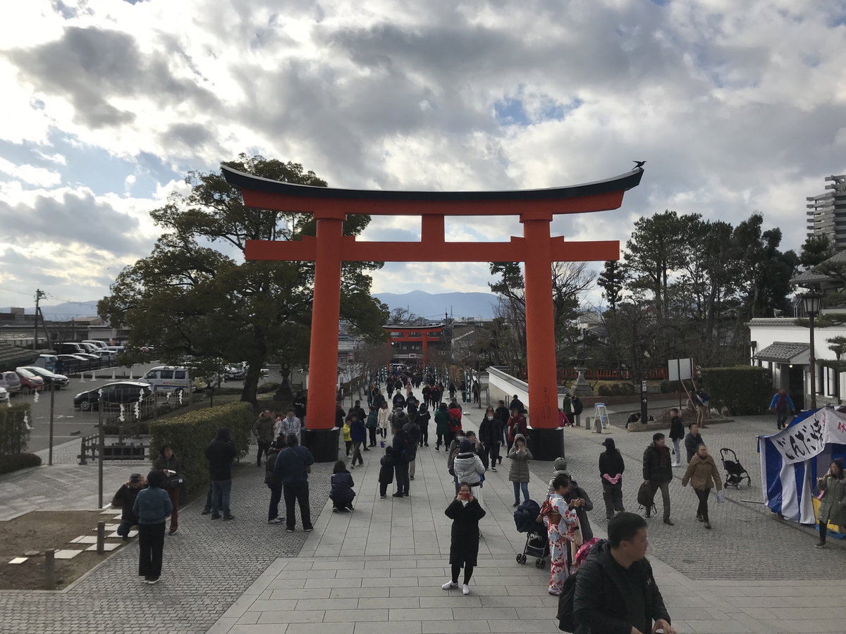 Sando and torii in front of Romon gate of Fushimi Inari Grand Shrine, Kyoto, Japan, 2019